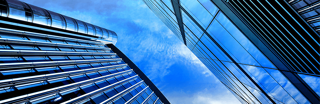 Image - looking up between two office towers blue sky